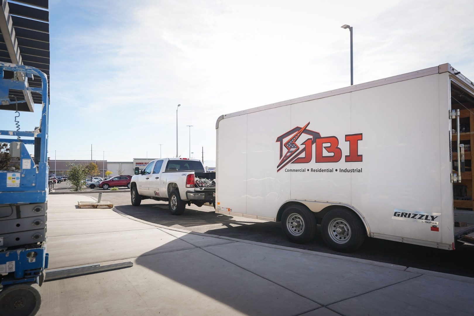 A contractor crew and equipment trailer on a commercial job site in Utah